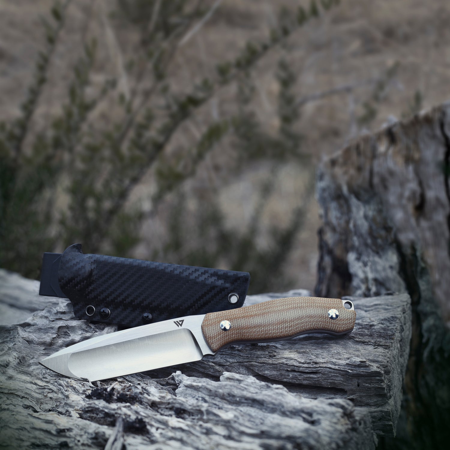Wilora Crest Full Tang, Micarta Handle Knife with a black sheath.