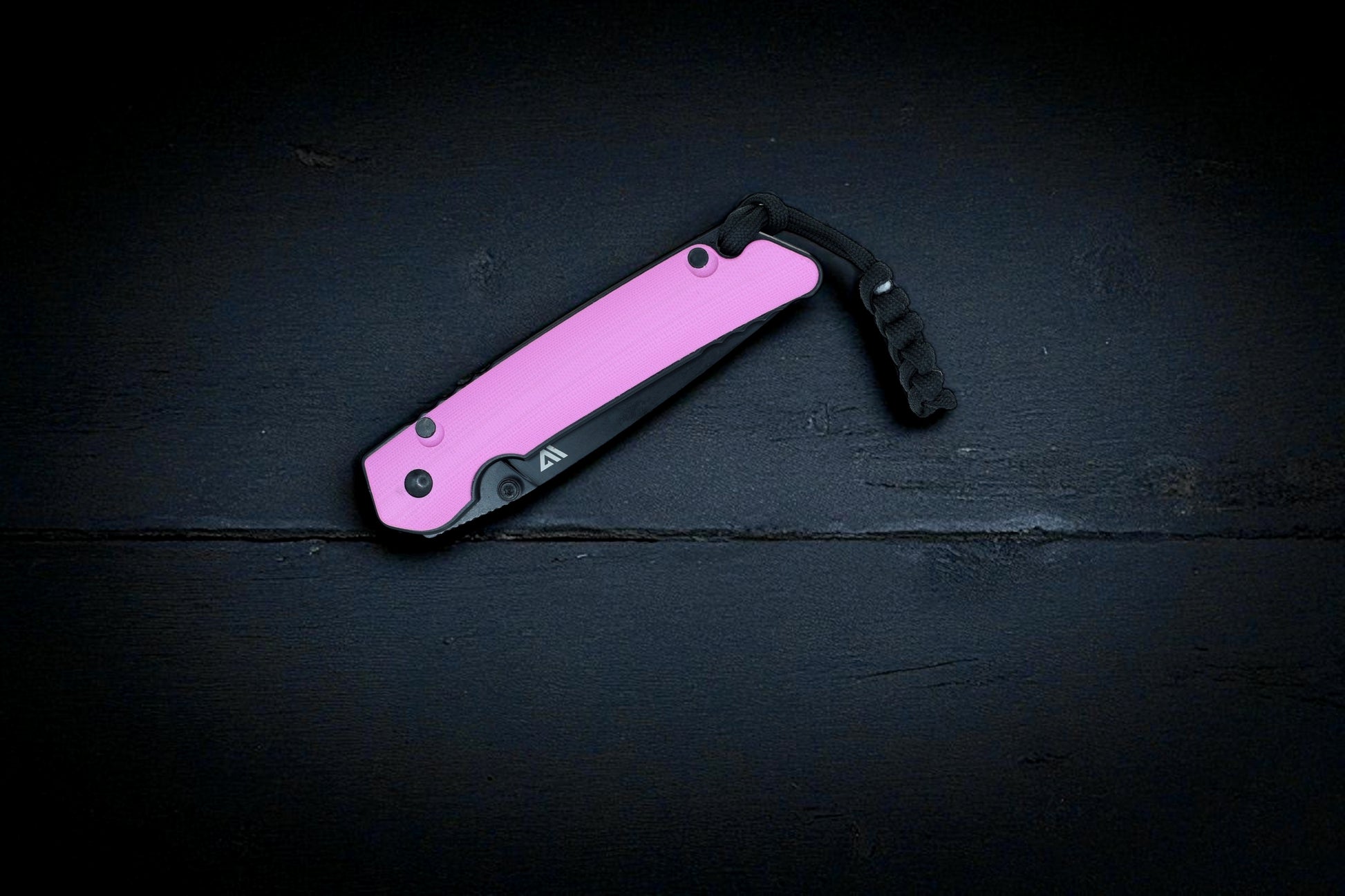 Wilora The Tarn D2 folding knife closed with pink G10 handle